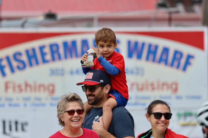 Owen Murphy has a great seat for the parade along Savannah Road, his father Brian’s shoulders. Jan Allmaras, left, and Caitlin Murphy also watched the parade.