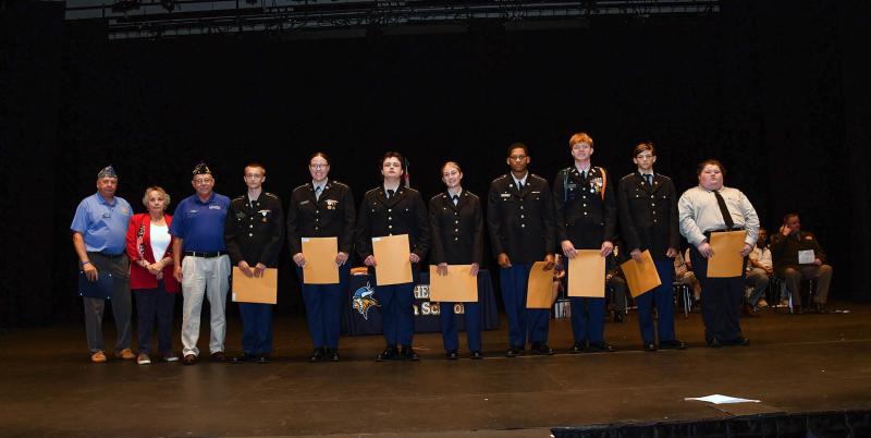 Mike Mulligan and Kellie Bergen present American Legion Post 17 awards to cadets Anthony Bryant, military excellence; Jenna Calhoun, scholastic excellence; Kaleb Krook, Americanism Medal; Lainey Bertolotti, Athletic Medal; Tyzae Harmon, Citizenship Medal; and Medals of Merit to Mason Furman, James Berg and James Robinson.