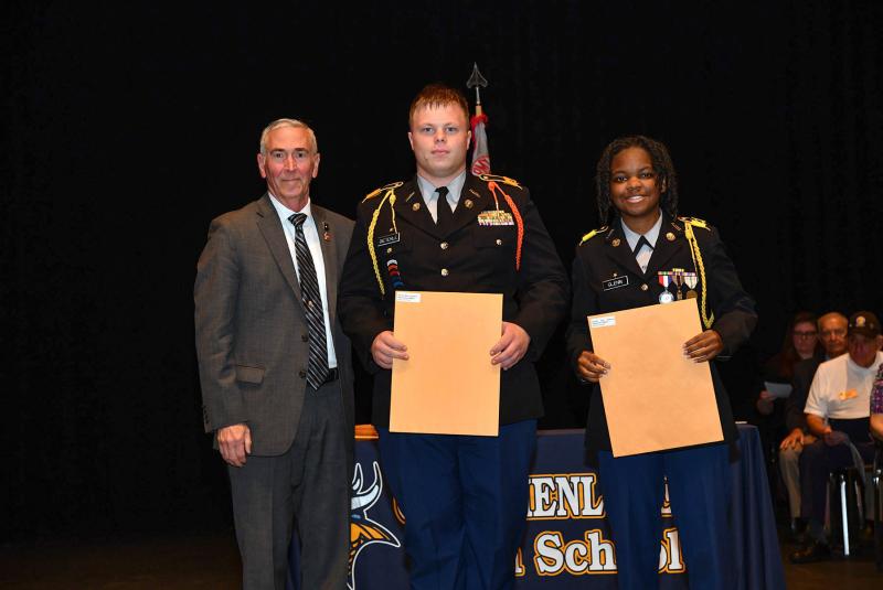 Maj. Gen. Fran Mahon presents the Korean War Veterans Association Medal and Scholarship to cadets Brent Dieterle and Kamille Glenn.