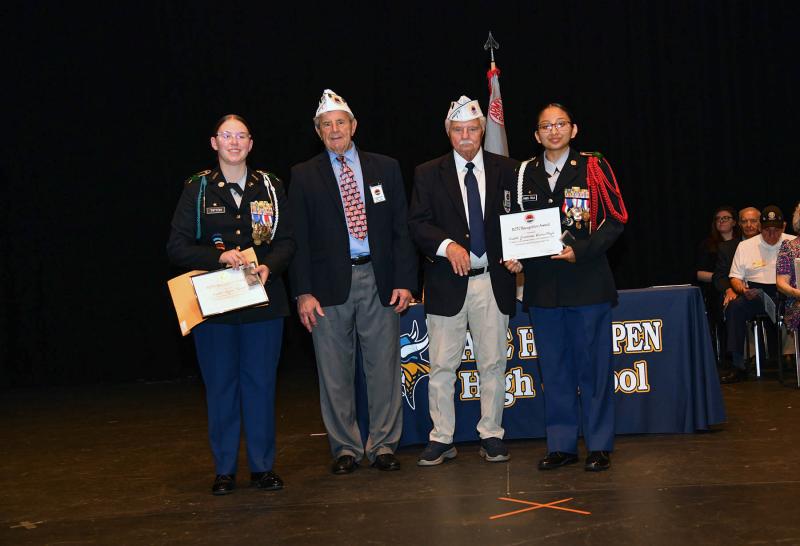 Tom Jones and Dave Hefernan present the Sussex AmVets (David Dolby) Post 2 Medal and Scholarship to cadets Rylee Tipton and Jazmine Ramos-Trejo.