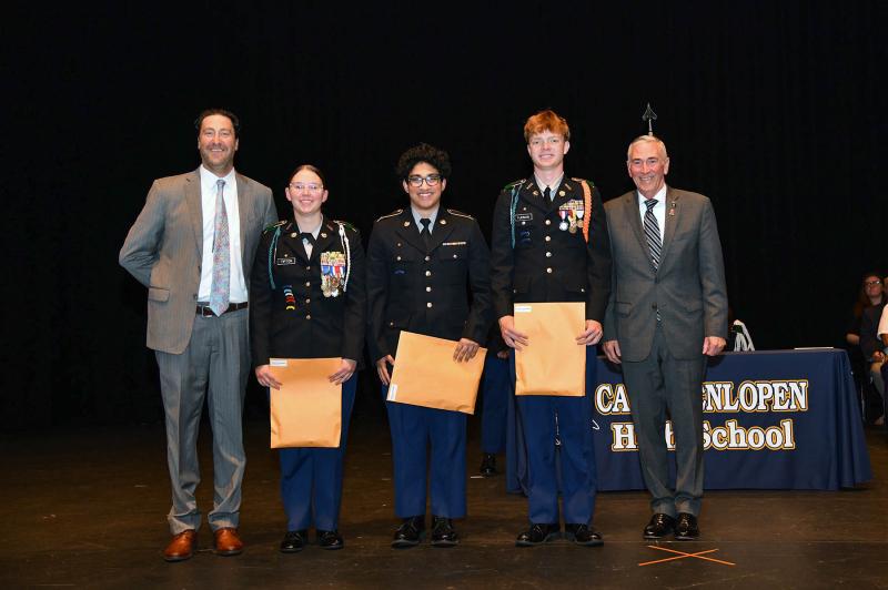 Maj. Gen. Fran Mahon and Andrew Coulter present the Department of the Army Superior Cadet Decoration to cadets Rylee Tipton, Bijan Sorab and Mason Furman.