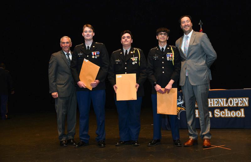 Maj. Gen. Fran Mahon and Andrew Coulter present the Cadet Command Distinguished Academic Award to cadets Cole Huxtable, Michael Strunk and Tyler Haun.