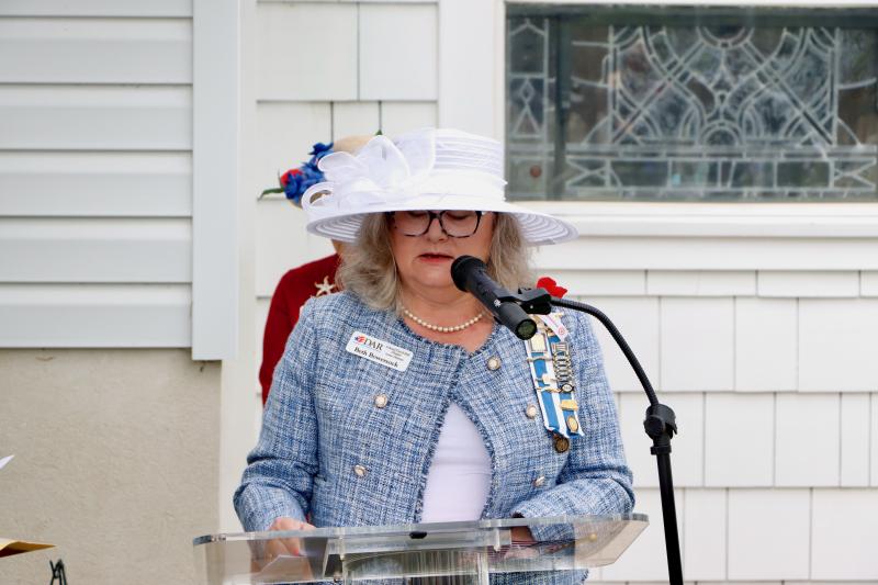 Beth Bowersock, regent, Col. David Hall Chapter, Daughters of the American Revolution, addresses the ceremony attendees.