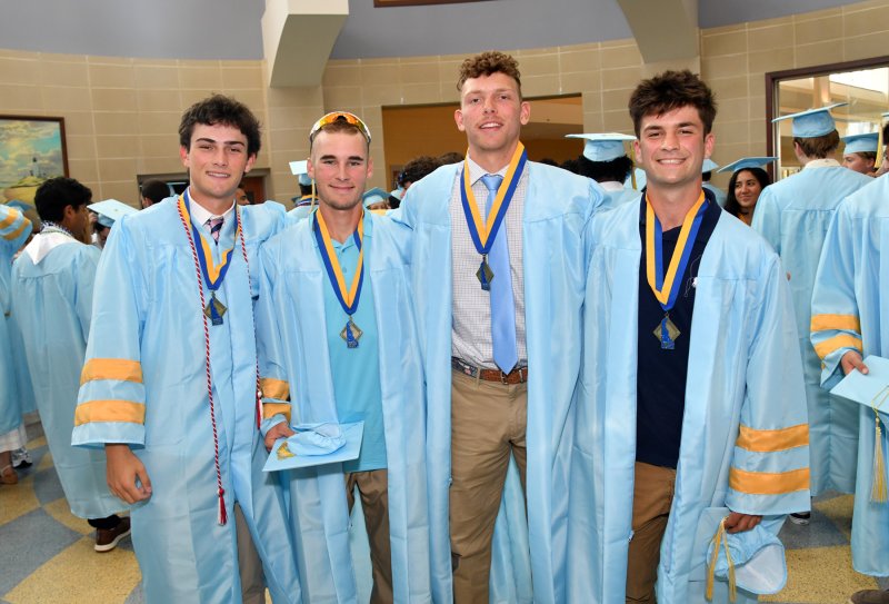 Donning their baseball state championship medals are (l-r) Brad Marks, Malachi Woods, Trey Hitchcock and Brady Kosc.