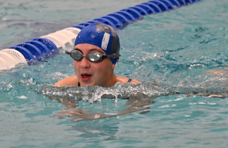 Senior Norah Block swims the breast.