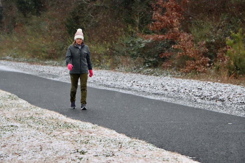 People still take their morning walks in the snow down the Lewes-to-Georgetown Trail. BILL SHULL PHOTO