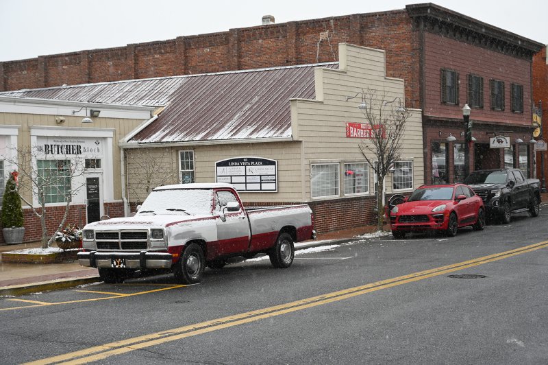 This old truck gets a fresh coat of snow on Union Street in Milton. NICK ROTH PHOTO