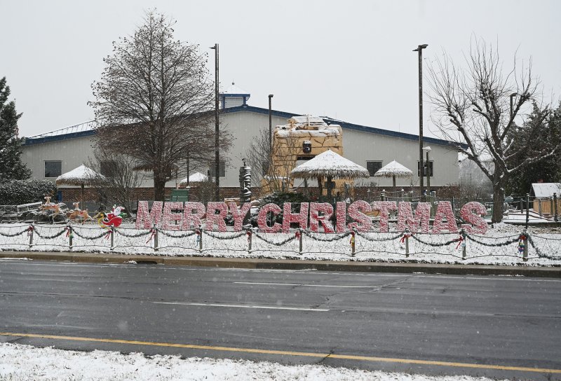Snow covers the Merry Christmas message at Shell We Golf on Route 1. NICK ROTH PHOTO