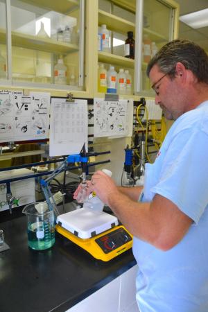 Wastewater operator Randy Paugh conducts analytical testing in the Inland Bays laboratory. BY RON MACARTHUR