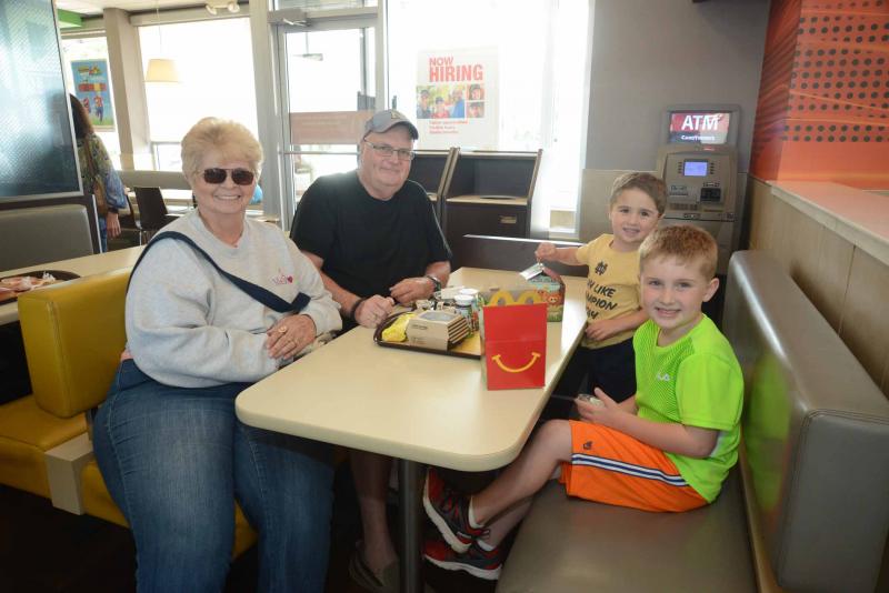 Navy veteran Steve Rosenthal sits down with his wife and grandchildren for a meal in McDonald’s including a Signature Crafted Recipes sandwich for Rosenthal. Shown are (l-r) Dot and Steve Rosenthal, and Carter and Cooper Rosenthal. McDonalds