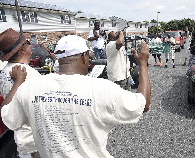 James Gibbs gives a sermon at the Georgetown Apartments. DENY HOWETH PHOTOS