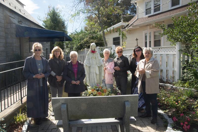 Church members gather at the statue of the Virgin Mary for a group photo. Shown are (l-r) Rachel Leonardo, Beth Petrusic, Joan Brohawn, DeLourdes Hollis, Barbara Kelly, Bridget Touhey and Theresa Treglia. Miracle of Fatima