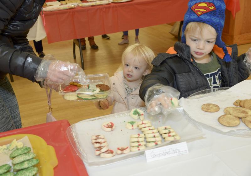 Elise and Graham Tuske are mesmerized by the tables of cookies.