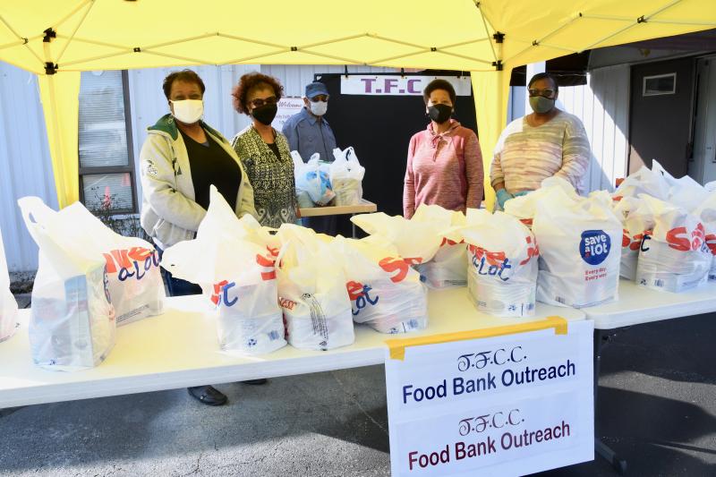 Trinity Faith Christian Church members distributing food to the public are (l-r) Lynette Griffin, Trina Brown-Hicks, Bishop Arthur Jones, Darlene Mitchell and Debbie Treherne. RON MACARTHUR PHOTO