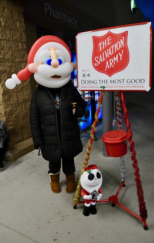 The annual holiday Salvation Army kettle drive continues during the pandemic. Krystle Clapp of Seaford draws attention to her kettle with an artistic Santa balloon head as she tends a kettle at Walmart near Rehoboth Beach.
