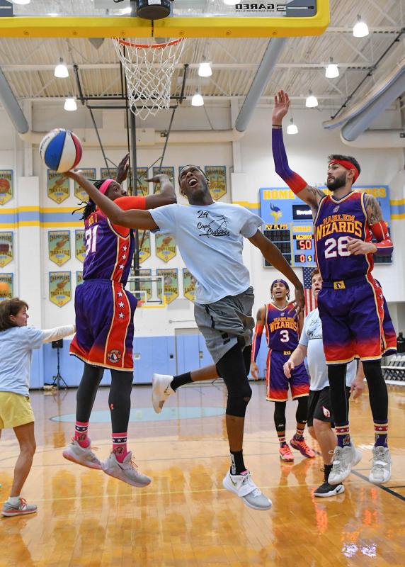 Swoop' from Harlem Wizards visits Lake-Noxen Elementary School