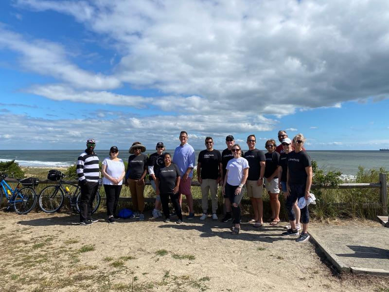 Compass team volunteers for beach cleanup | Cape Gazette