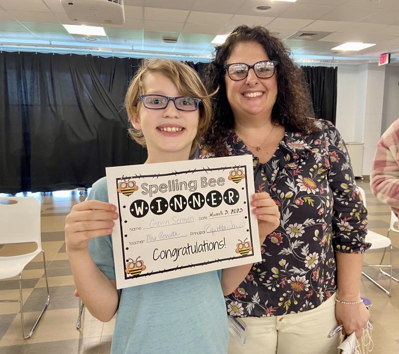 After a tough competition, fifth-grader Gavin Serman was named Love Creek Elementary Spelling Bee champion. Gavin is congratulated by contest coordinator and fifth-grade special education teacher Bridgette Perrotta. ELLEN DRISCOLL PHOTO