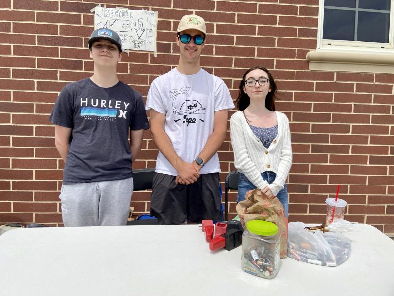 Cape High students (l-r) Will Runde, Chris Runde and Mackenzie Hansen collect materials at Cape High. ELLEN DRISCOLL PHOTO