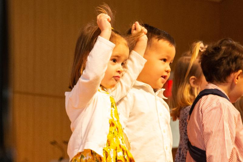Duckling Class students Addie Carpenter, left, and Nash Johnston look out at the audience.
