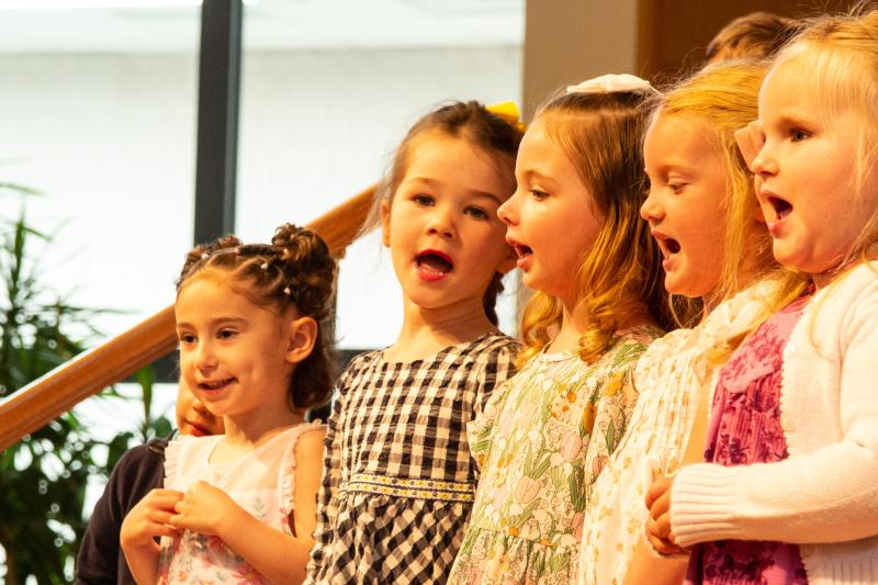 Dolphin Class students (l-r) Morgan Moskowitz, Caroline Coveleski, Cassie Danz, McKinlee Mays and Emery Taylor sing together.