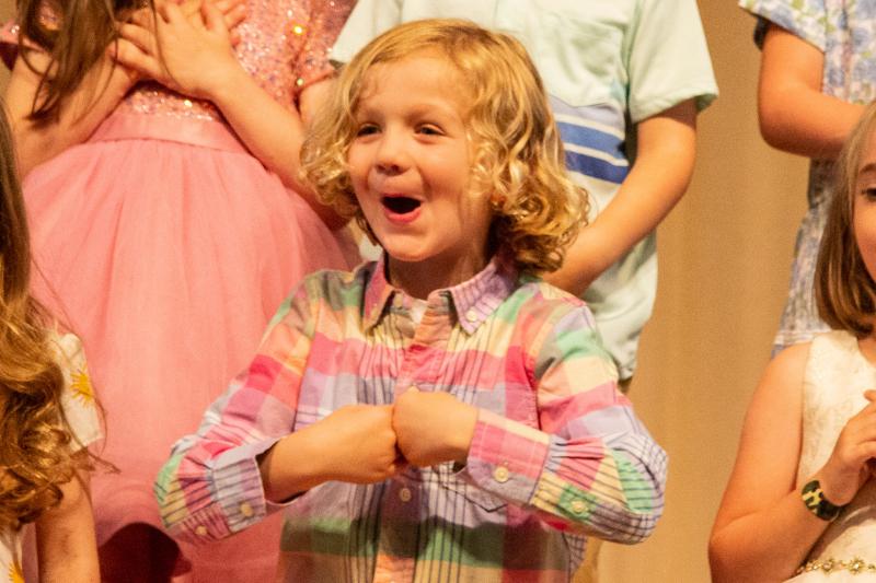 Pelican Class student Asa Feindt happily sings. BETH FEIGLEY PHOTOS
