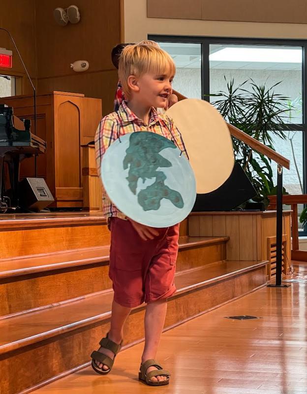 Eric Dyer plays the part of “The World” during the Penguin Class skit.