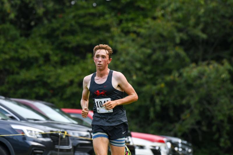 Brynn Crandell walks all the dogs at Lake Forest Invitational Cape