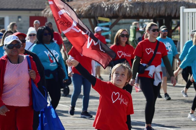 A young supporter waves a flag in support of Team Bob.