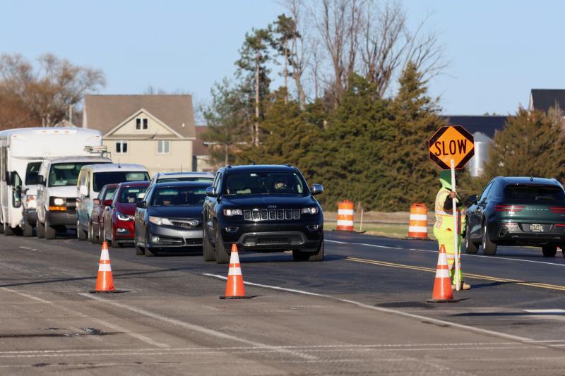 Drivers heading west on Kings Highway are stopped at Gills Neck Road while eastbound traffic is allowed to get by. The current construction, which is causing long delays, is related to the new Mitchell’s Corner development. BILL SHULL PHOTOS