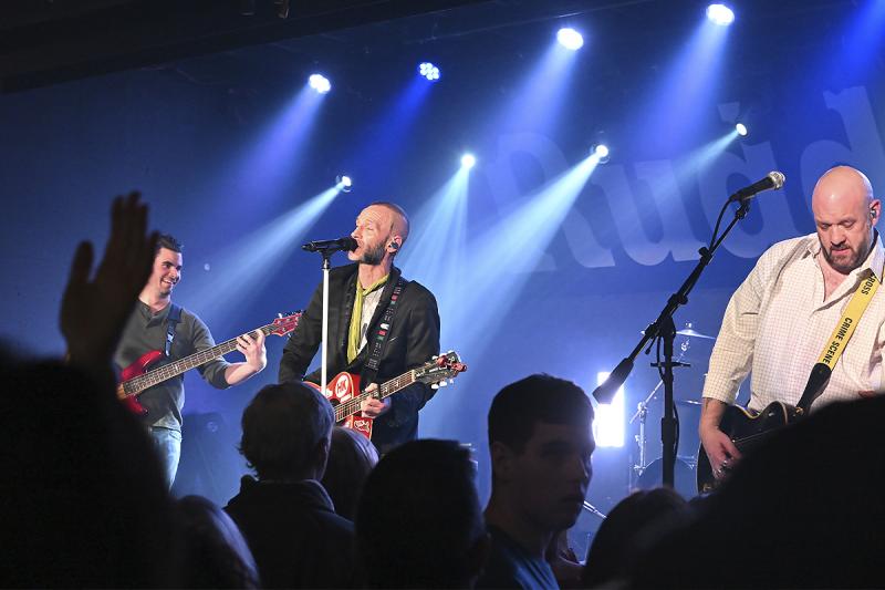 Bryen O’Boyle and Just the Tip perform to a packed room of people.