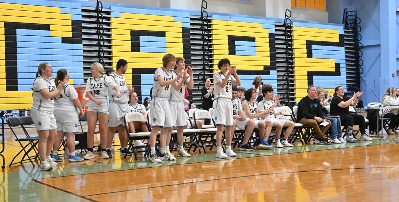 The bench cheers on their team.