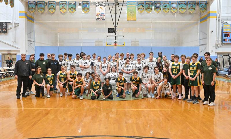 Both teams come together after a hard-fought game to show their camaraderie.