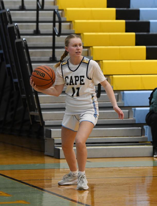Grace Heers looks to drive baseline.