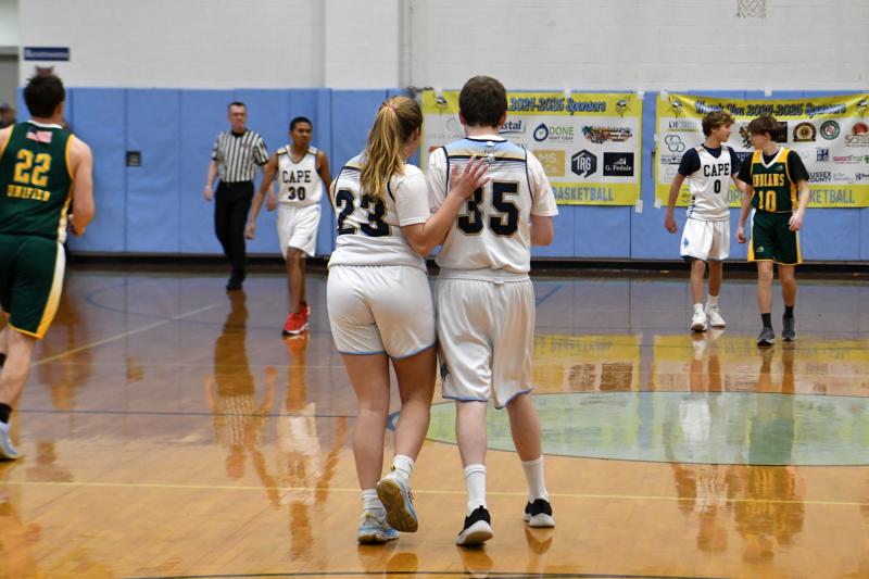 Lina Frederick congratulates Danny Gartman on his offensive play.