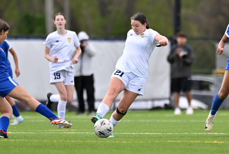 Cape freshman Bridget Connelly boots a clear for the JV Vikings.