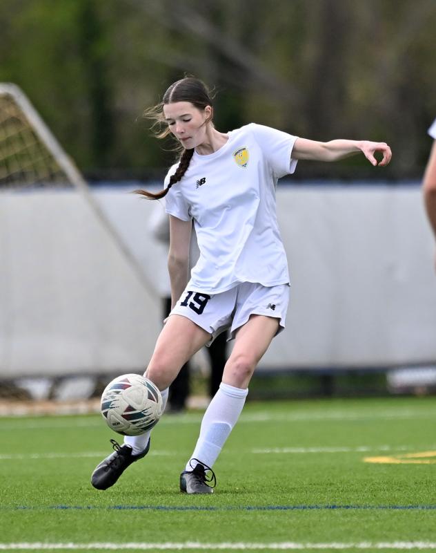 Freshman Delaney Huxtable clears the ball from the CR offensive zone during the JV match.