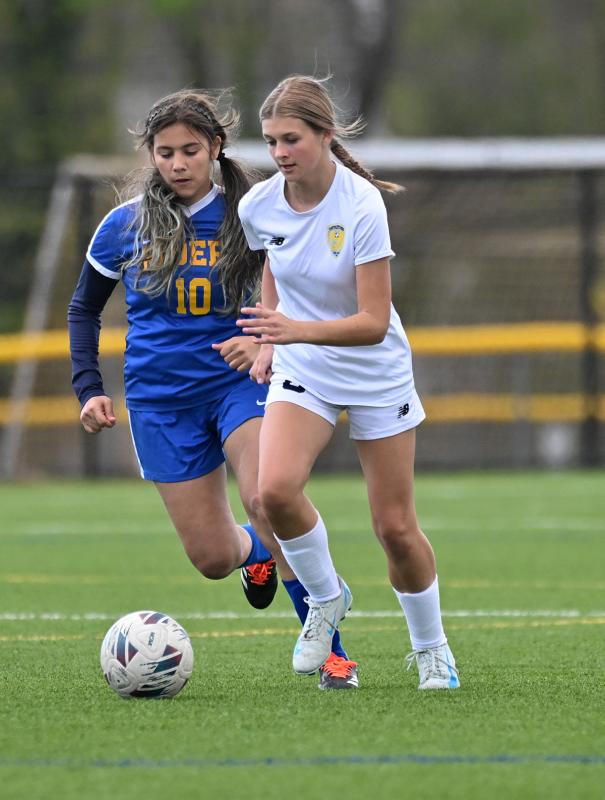 Alisa Tsirtsan speeds the ball upfield in the JV victory.