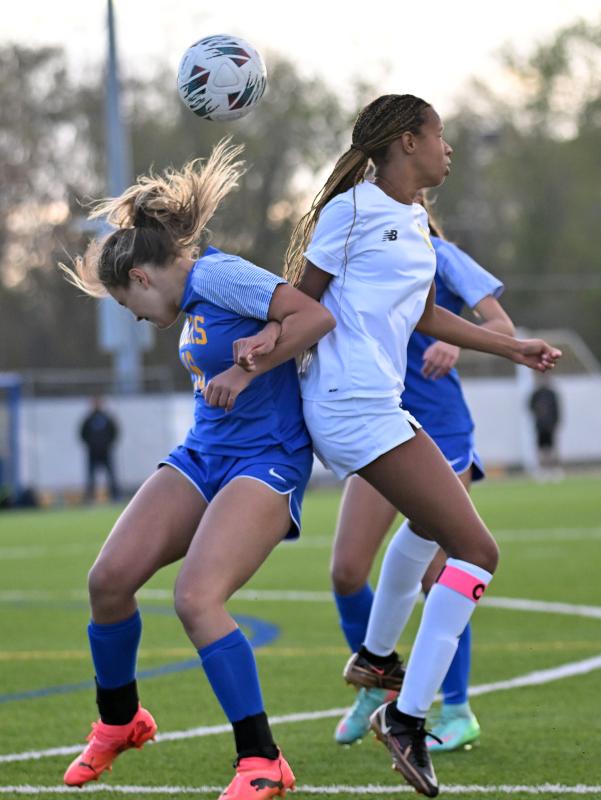 Cape junior Ava Brown gets tangled with Caesar Rodney’s Avery Lykens.