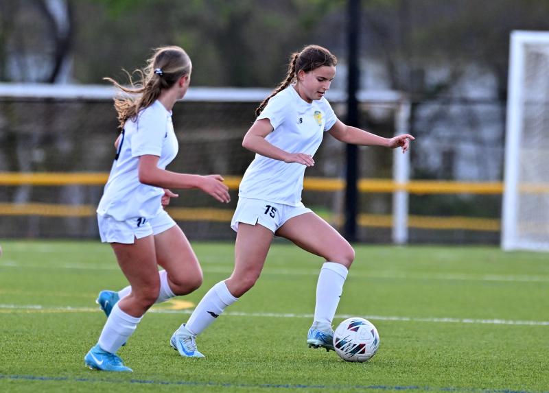 Sophomore Isla Touw, right, dribbles the ball out of the Riders’ offensive zone.