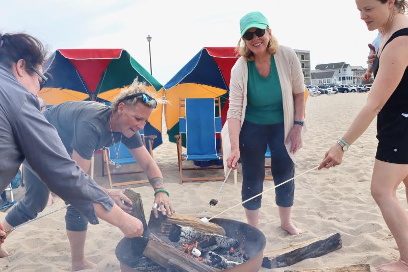 Councilwoman Amy Marasco, center, who will soon become mayor of Lewes, joins in the marshmallow roasting at the April 19 community bonfire on Savannah Beach. The city hosted the event to commemorate Paul Revere’s historic ride and to kick off the celebration of the nation’s 250th birthday.