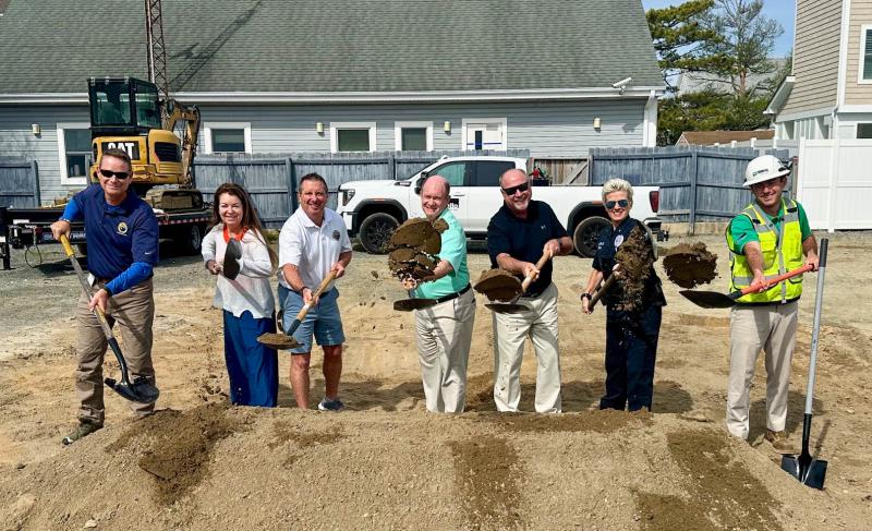 Dewey Beach officials and Sen. Chris Coons do a ceremonial groundbreaking for the new town hall and public safety building April 25. Shown are (l-r) Town Manager Bill Zolper, Commissioner Elisabeth Gibbings, Mayor Bill Stevens, Coons, Commissioner Paul Bauer, Police Chief Constance Speake and Costello Construction’s Nic Costello. SUBMITTED PHOTOS
