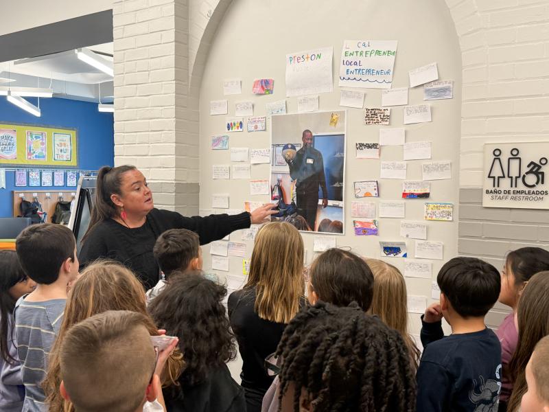 Milton Elementary third-grade teacher Brittany Matthews discusses the display about Preston Russell with her students. SUBMITTED PHOTOS