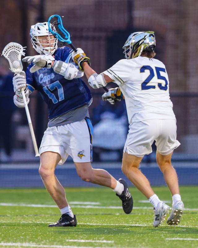 Cape’s Brenner Short avoids the check of a Sallies defender.