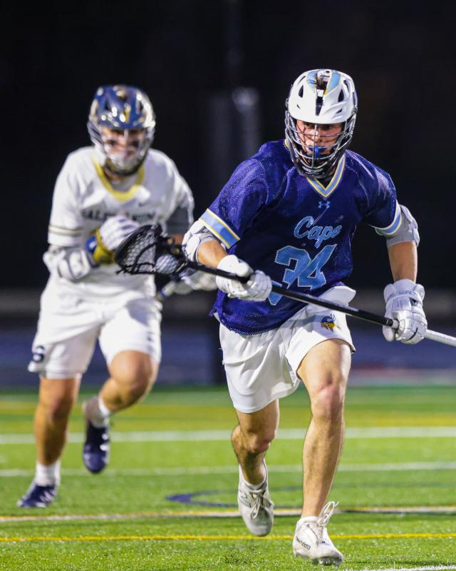 Long pole Jake Hutchison speeds the ball upfield on a clear.