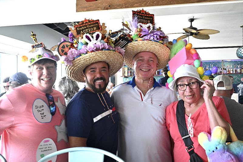 Dolled up in their Hollywood-themed bonnets, (l-r) Doreen Weaver, Kevin Miller, Mike Pieroravio and Anna Hernandez are out having a blast.
