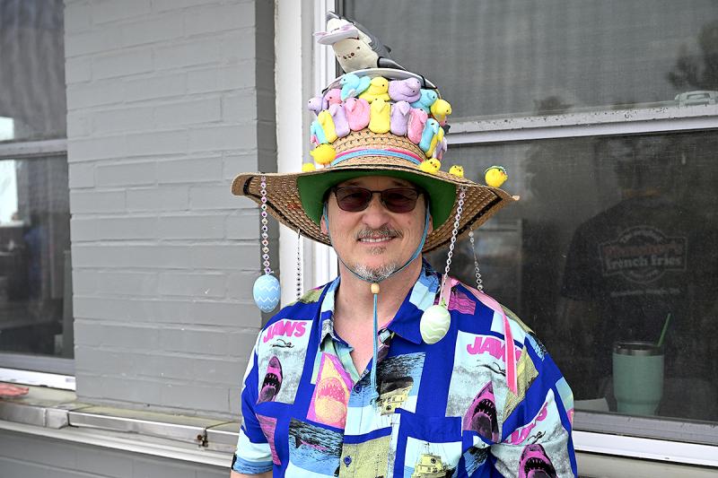 Bobby Croker celebrates the anniversary of the movie “Jaws” with a motorized, twirling shark on his bonnet.
