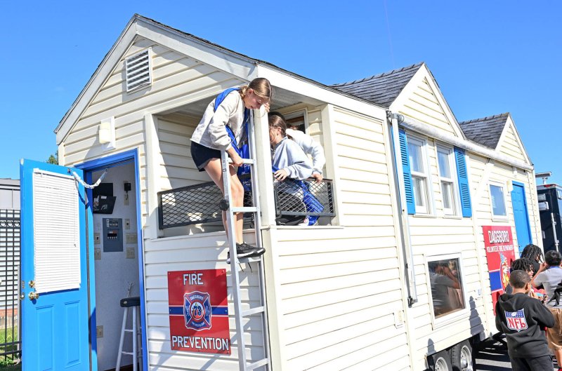 Vivian Illian exits the Dagsboro Volunteer Fire Company’s fire prevention house.