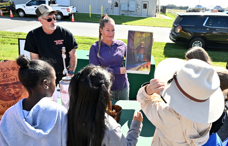 Jeff Torres and Ashley Melvin of the Delaware Forest Service educate students on forest fires.
