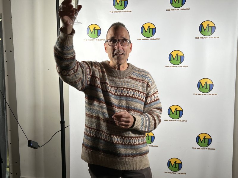 Milton Theatre Director Fred Munzert makes a champagne toast Oct. 28, as the theater begins construction on its new education wing. Construction on the nearly $3 million project is expected to last into late summer 2026. RYAN MAVITY PHOTOS